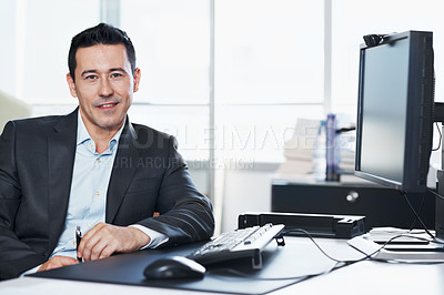 Buy stock photo Portrait of a businessman sitting at his desk 