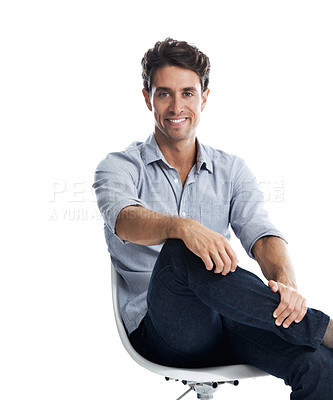 Buy stock photo Handsome young man smiling while sitting on a chair - isolated on white