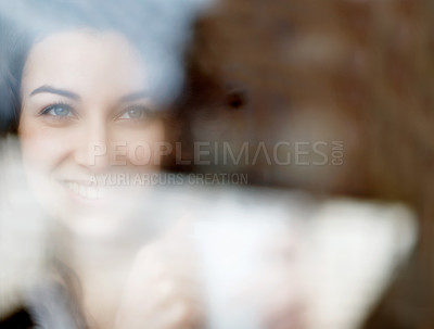 Buy stock photo A beautiful young woman looking through a foggy window on a crisp morning