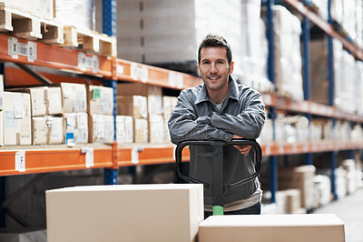 Buy stock photo Portrait of a young man standing in a storehouse