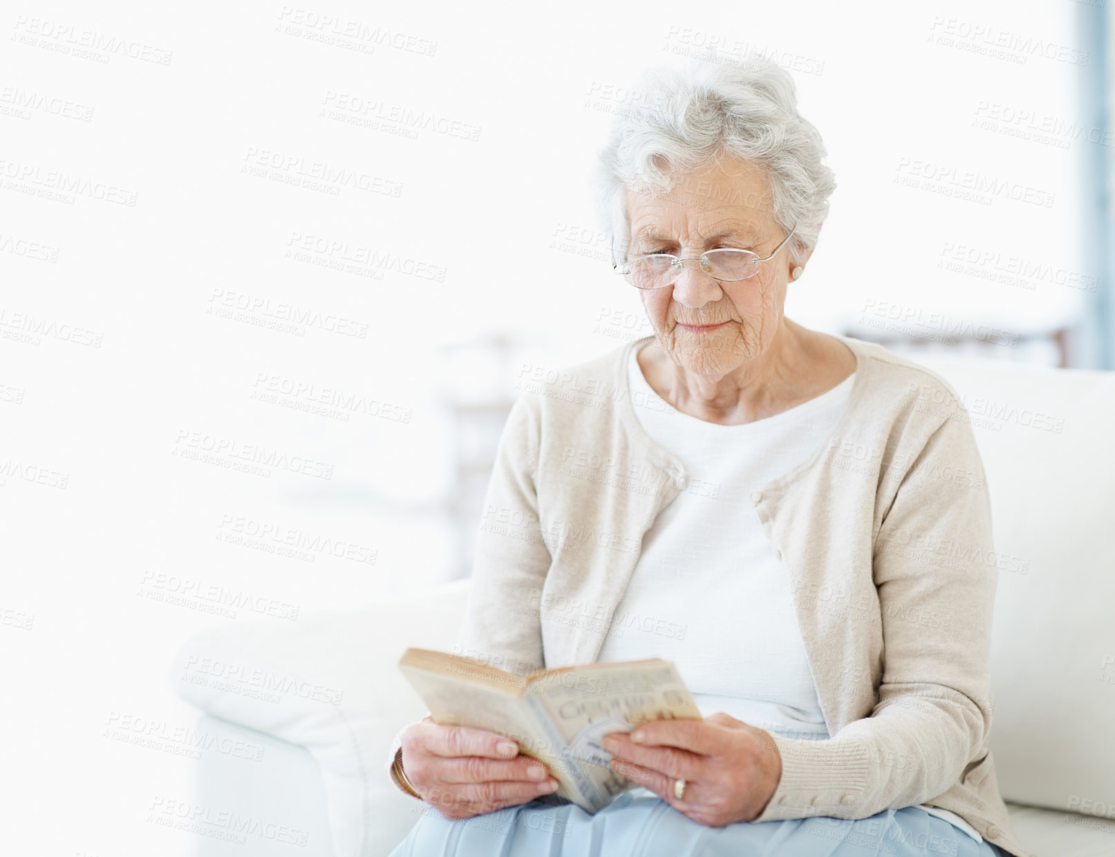 Buy stock photo Calm, book or old woman on sofa with reading, fantasy novel or insight in literature hobby. Space, glasses or senior person in home with fairytale, peaceful moment or fiction story in retirement.