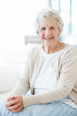 Buy stock photo Happy, portrait and senior woman in lounge, retirement or comfortable with positive attitude on sofa. Confident, home and elderly person with smile in living room, relax and peaceful holiday in house