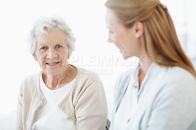 Buy stock photo Love, senior mother and adult daughter in home, smile and connection together on weekend break. Elderly parent, happy women and bonding in living room for relax, care and family portrait at house
