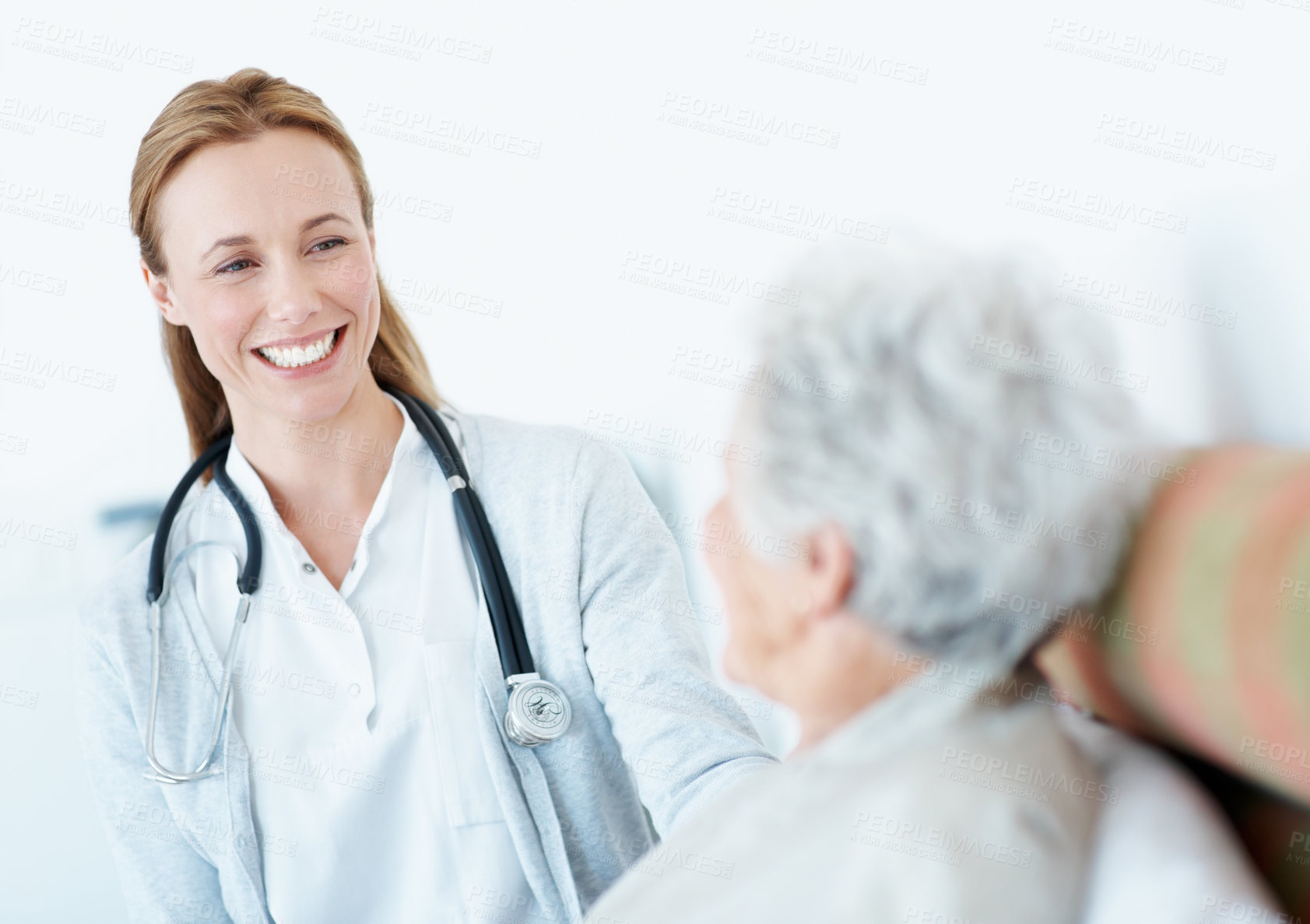 Buy stock photo Happy, caregiver and senior woman in nursing home, medical appointment and consultation for patient. Assisted living, retirement and nurse with elderly person, rehabilitation and health services