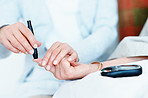 Checking her blood-sugar levels