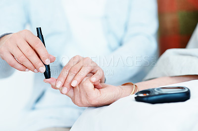 Buy stock photo Hands, caregiver and old woman in home with glucometer, testing sugar or analysis for blood levels. Nurse, injection and senior person at house with machine, diabetes assessment and medical treatment