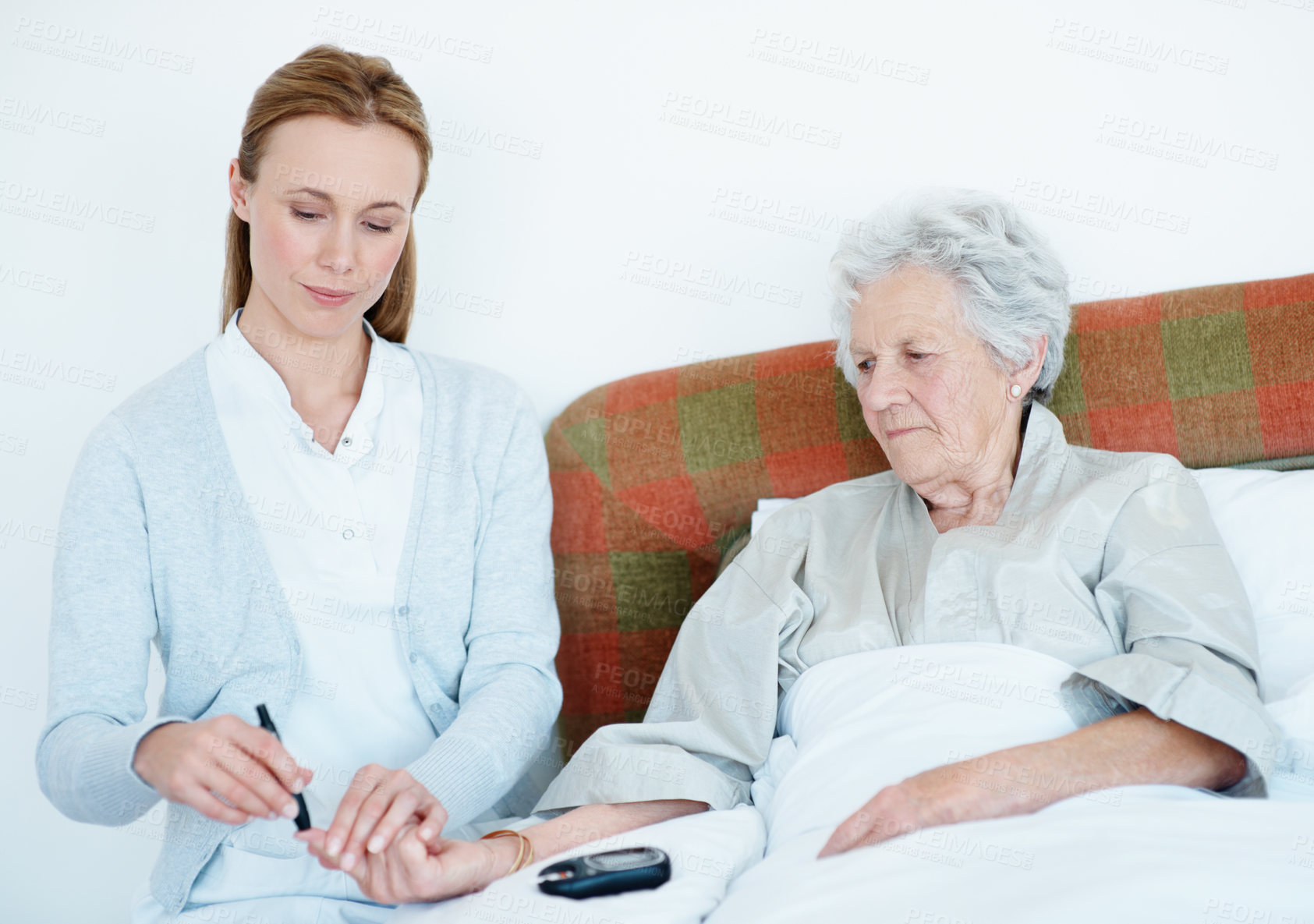 Buy stock photo Caregiver, needle and old woman in home with glucometer, testing sugar or analysis for blood levels. Nurse, injection and senior person at house with machine, diabetes assessment and medical wellness