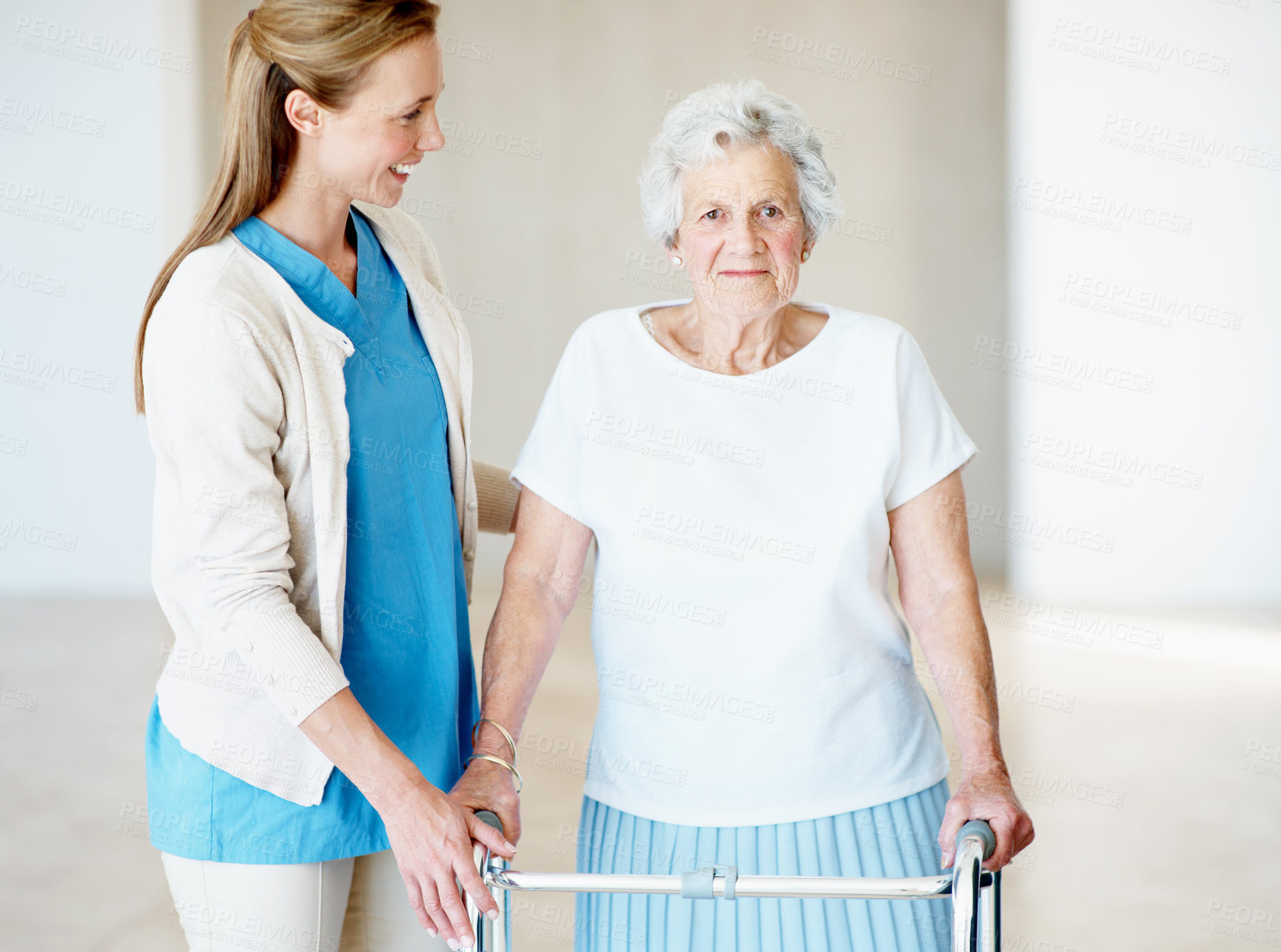Buy stock photo Help, caregiver and senior woman with walker at home, medical support or rehabilitation. Walking frame, nurse and happy person with disability, elderly care and portrait for assistance in retirement