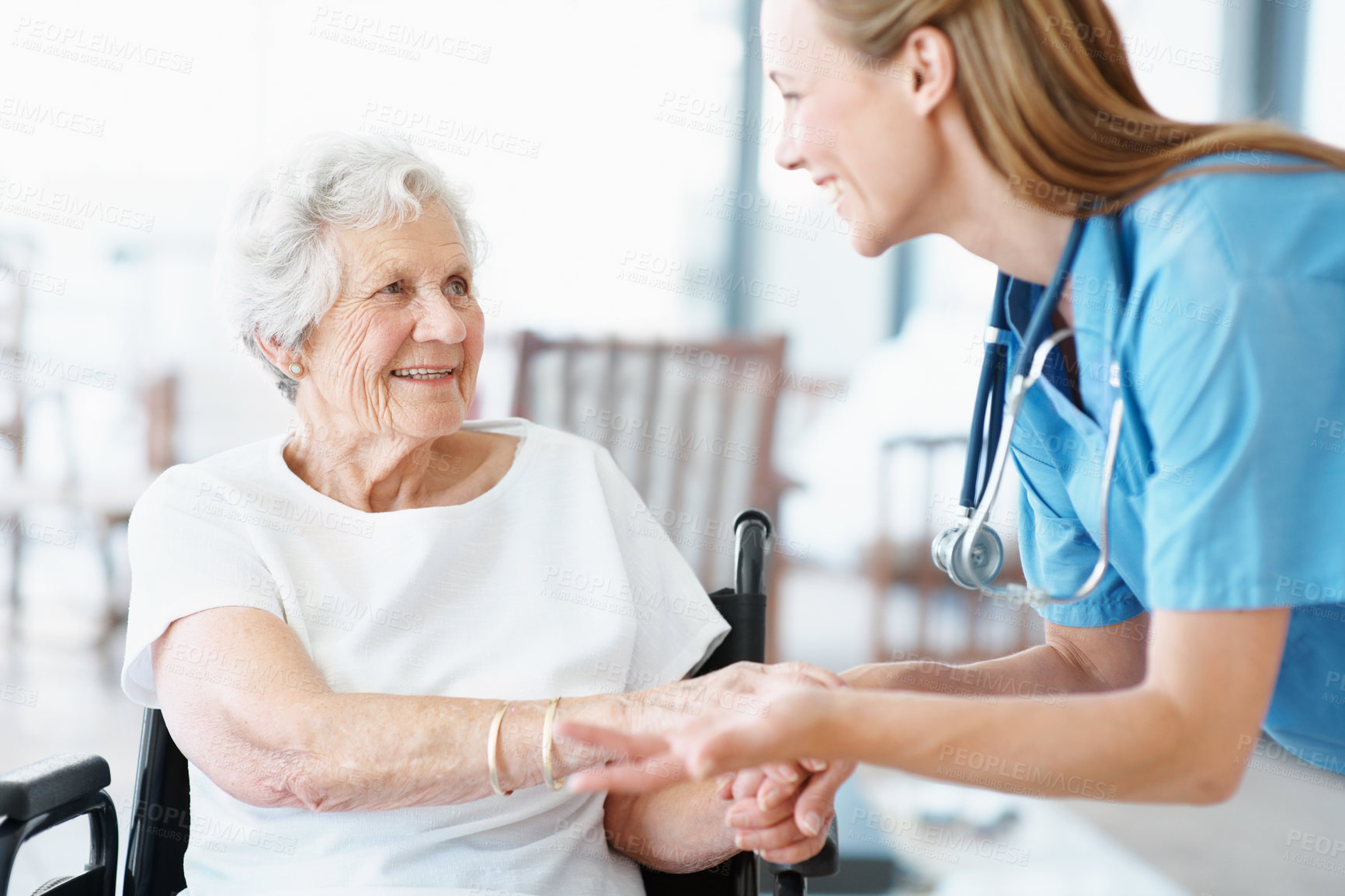 Buy stock photo Wheelchair, nurse and old woman holding hands for support, talk and healthcare or senior care. Caregiver, elderly patient or person with disability, wellness and happy in retirement at nursing home