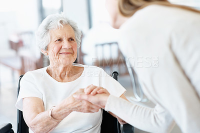 Buy stock photo Caregiver, handshake and old woman with wheelchair, smile or thank you for medical help in nursing home. Nurse, shaking hands and happy senior person with disability, trust or healthcare consultation