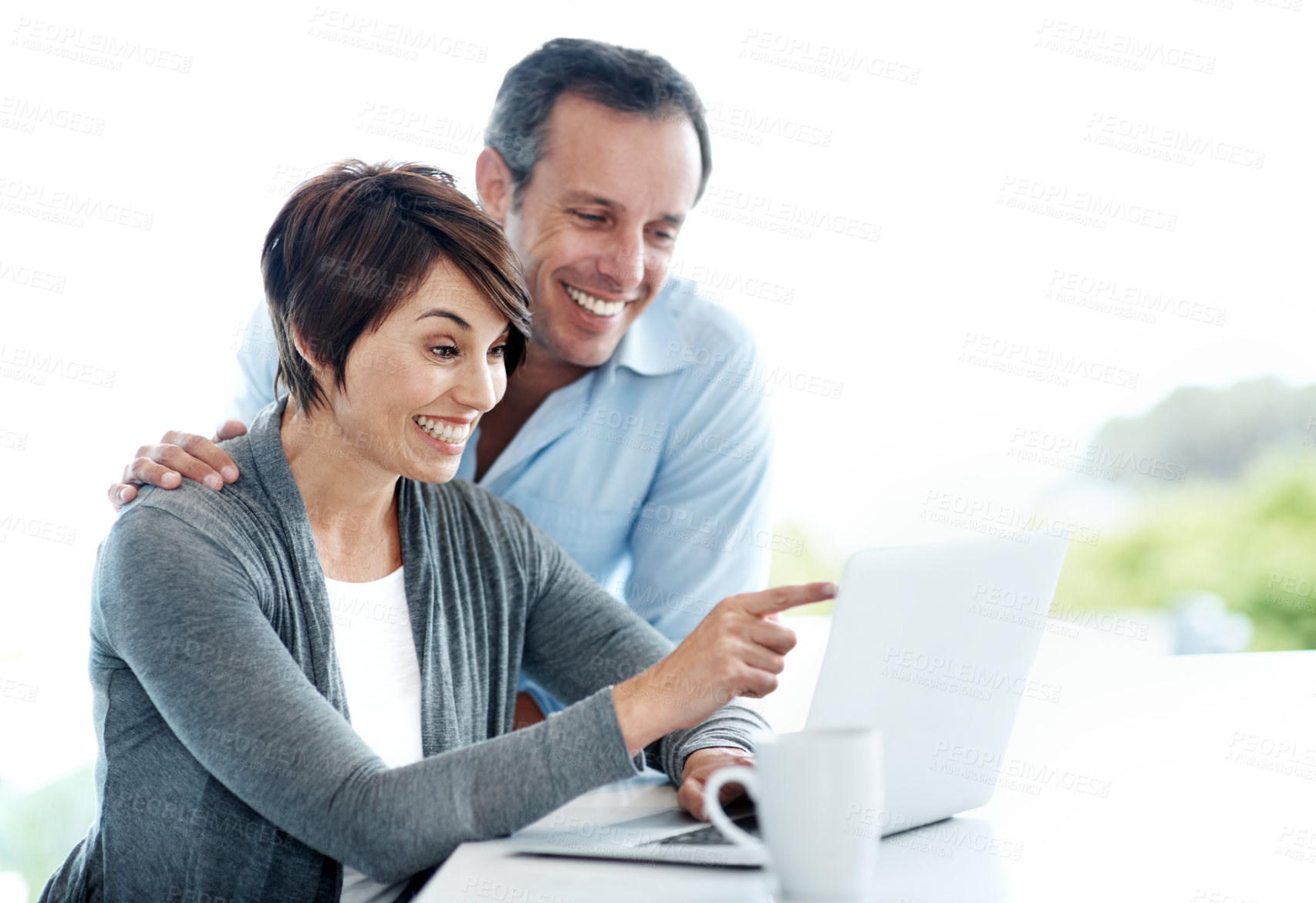 Buy stock photo Laptop, pointing and couple with coffee in home for finance, savings or investment approval for payout. Excited, good news and people on computer for reading financial blog for budget tips in house.