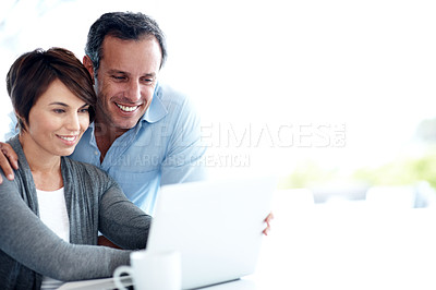 Buy stock photo Laptop, happy and couple in home by space for finance, savings or investment planning for payout. Smile, computer and man with woman, tech and reading financial blog for budget tips in house.