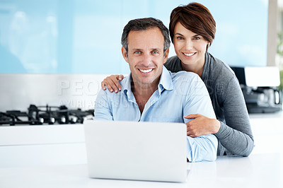 Buy stock photo Laptop, happy and portrait of couple in kitchen with finance, savings or investment planning for payout. Smile, hug and man with woman on computer for financial blog for budget tips in apartment.