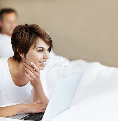 Buy stock photo Woman, thinking and laptop in bedroom with couple, relax or ideas for tv show, movie or streaming site. Female person, partner and space with inspiration for online entertainment with tech in home