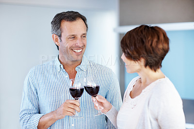 Buy stock photo Love, happy couple and toast with wine in home, connection and anniversary celebration. Man, woman and cheers with alcohol glass for romance, relationship goal and care with partner in house
