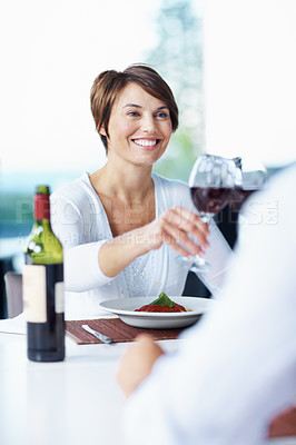 Buy stock photo Dinner, woman and couple cheers with wine at date, connection and anniversary celebration. Happy partner, people and toast with alcohol glass for romance, relationship goal and love with food at home