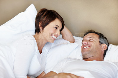 Buy stock photo Smile, morning and relax with couple in bedroom for romance, valentines day and marriage. Portrait, getaway and care with mature man and woman in home or staycation for anniversary retreat and love