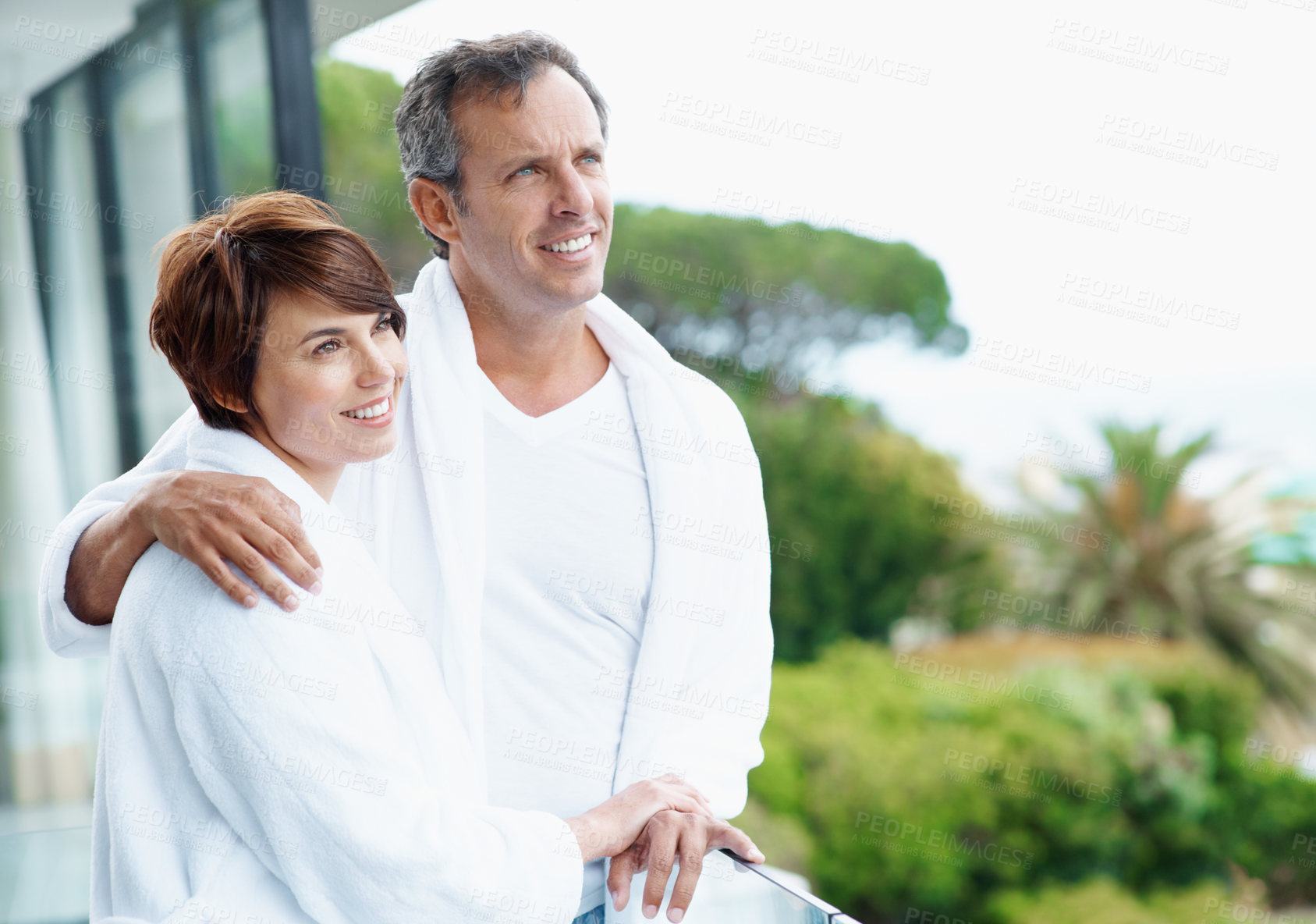 Buy stock photo Love, thinking and balcony with couple at hotel for travel, anniversary getaway or hug. Marriage, holiday villa and hospitality with man and woman at resort for view, vision or support space