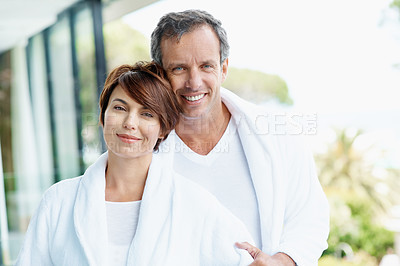 Buy stock photo Portrait, couple and relax at hotel with smile, affection and bonding together at holiday resort. Happy, people and love at accommodation, healthy relationship and connection for anniversary vacation
