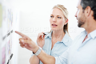 Buy stock photo Meeting, board and documents with business man in office for interior design, project and team. Blueprint review, architect brainstorming and pointing with employees in agency for proposal and pitch