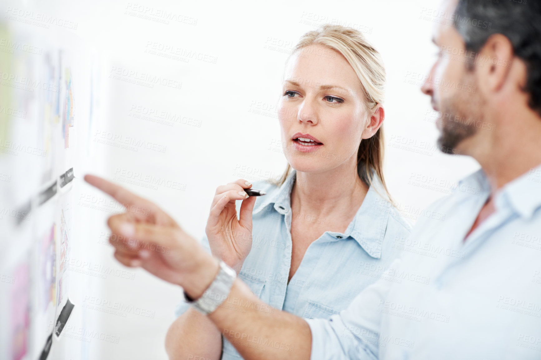 Buy stock photo Meeting, board and documents with business man in office for interior design, project and team. Blueprint review, architect brainstorming and pointing with employees in agency for proposal and pitch