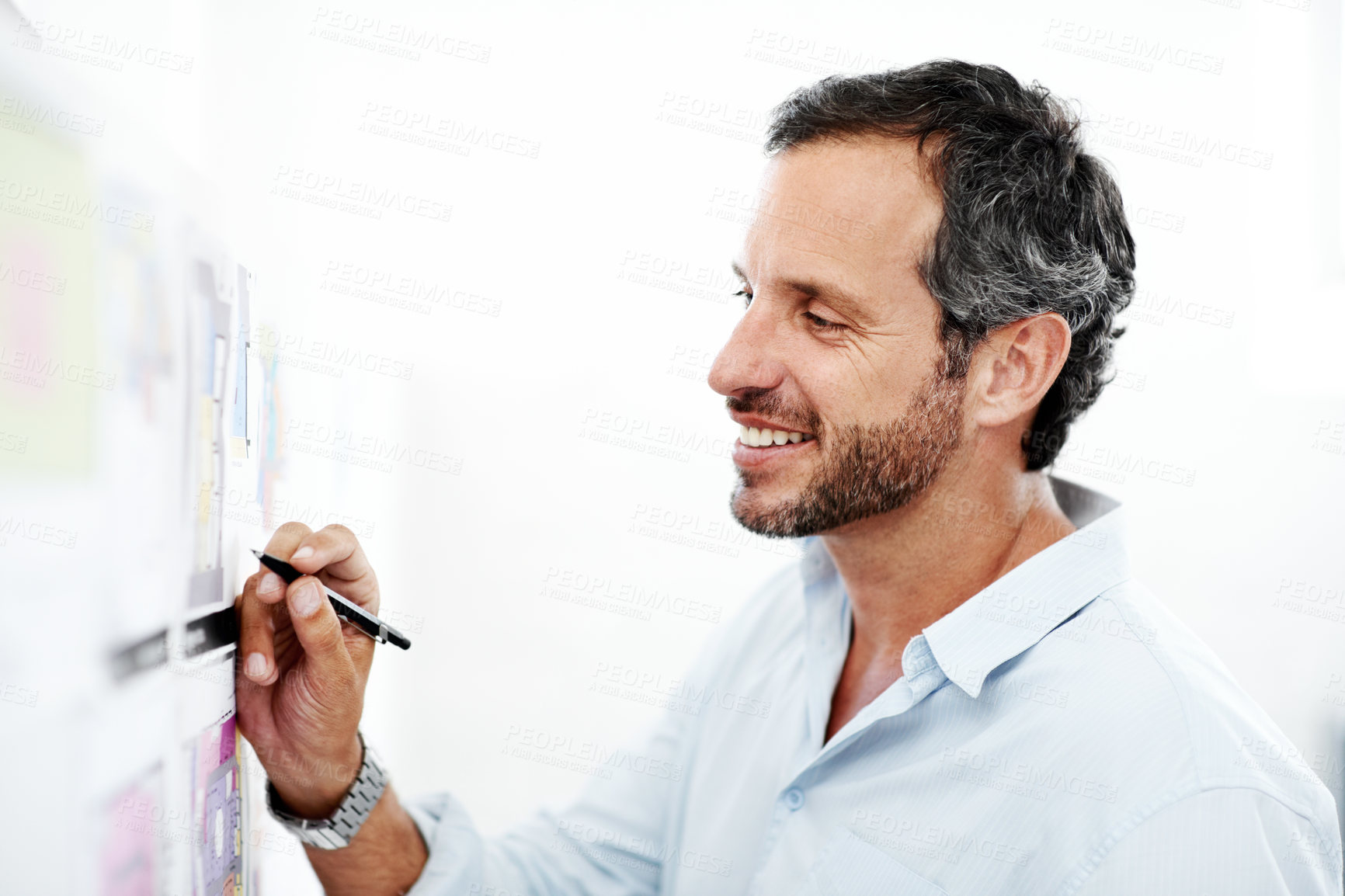 Buy stock photo Business man, writing and blueprint on board with review of layout, architecture and strategy analysis. Project, smile or architect with pen for floor plan, renovation overview and white background