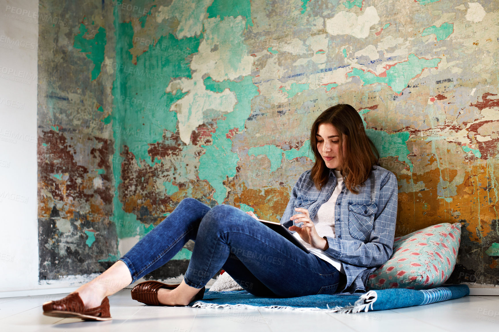 Buy stock photo Woman, tablet and reading on floor with smile, scroll and subscription for ebook or social media. Person, digital tech and relax in living room for notification, app post and streaming video in house