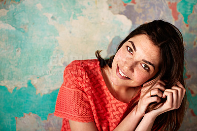Buy stock photo Portrait of a young woman posing in front of a map on a wall
