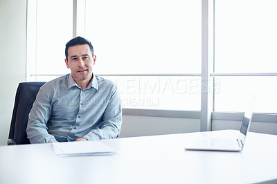 Buy stock photo Portrait of an executive sitting at a conference table in an office