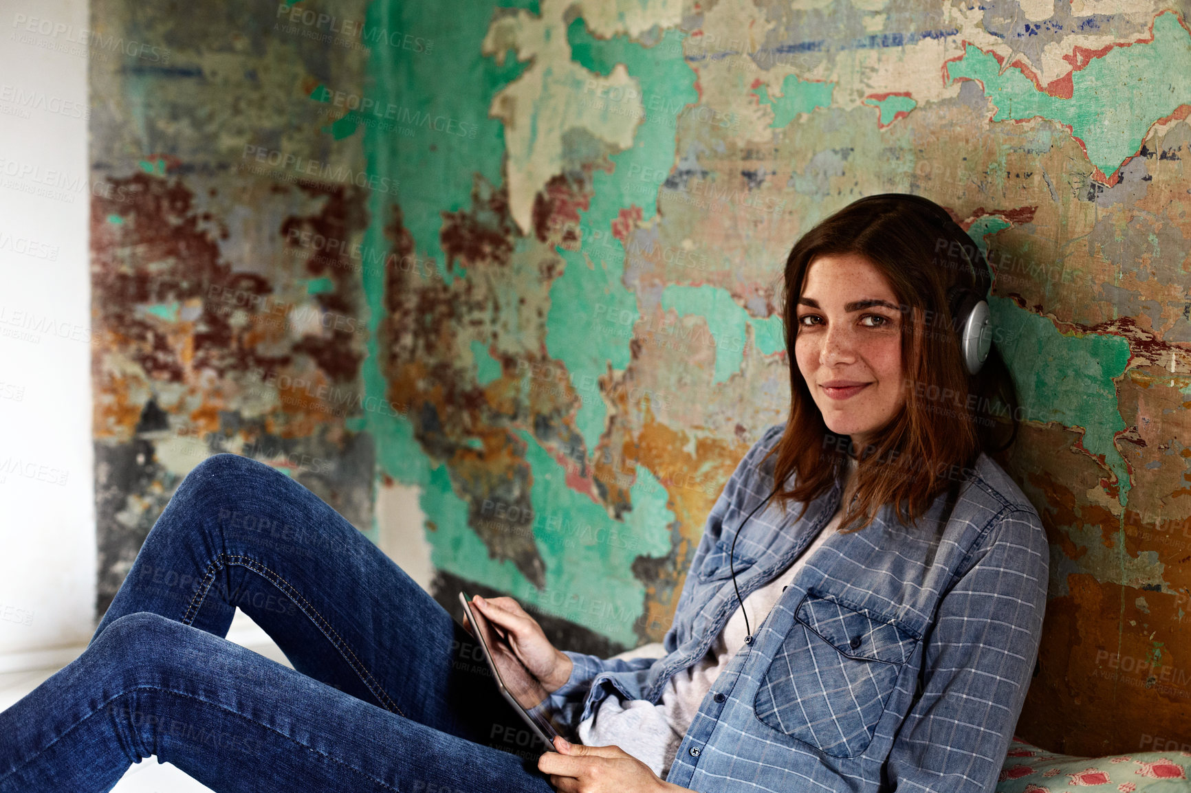Buy stock photo Woman, tablet and portrait on floor with smile, music and subscription for ebook or social media. Person, digital tech and relax in living room with headphones, app and streaming video in house