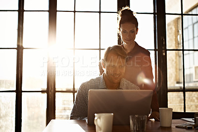 Buy stock photo Shot of a couple working together at home