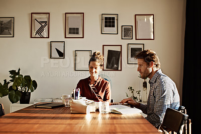 Buy stock photo Shot of a couple working together at home
