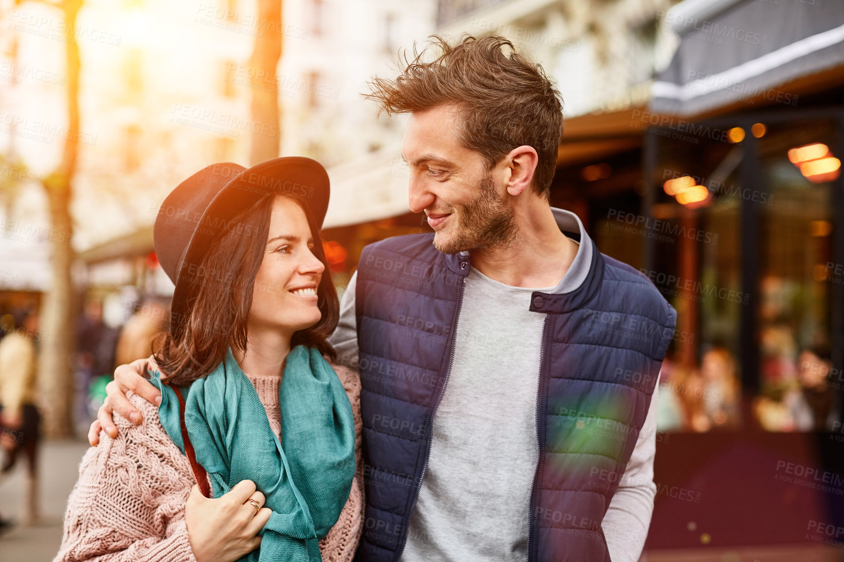 Buy stock photo Shot of a smiling young couple walking together in the streets of Paris