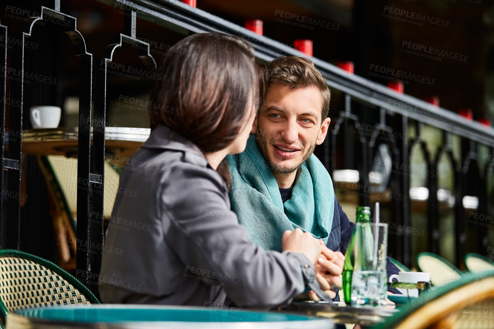 Buy stock photo Couple, restaurant and conversation on date for bonding, catching up or talking for connection. Communication, support and man with smile and partner in cafe, chat or romance with get together