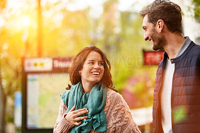 Buy stock photo Shot of a smiling young couple walking together in the streets of Paris