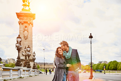 Buy stock photo Shot of a smiling young couple walking together in the streets of Paris