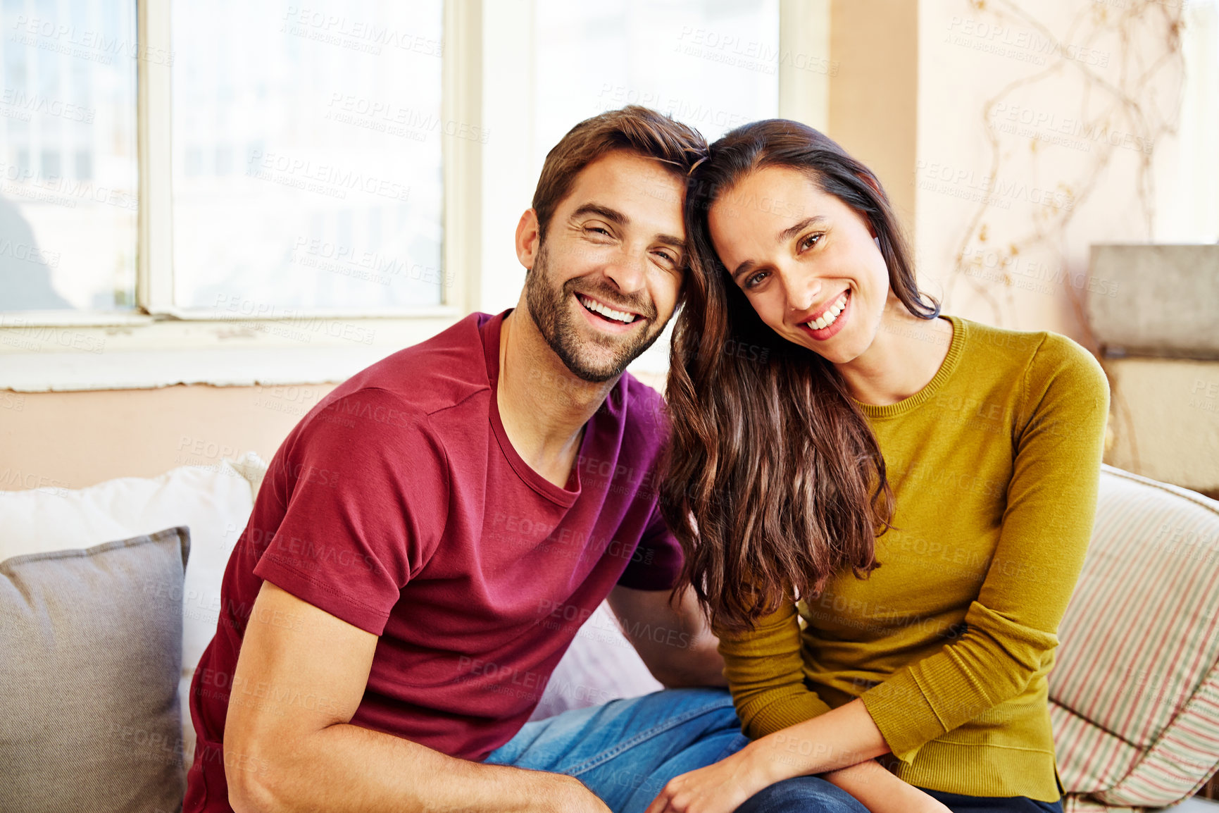 Buy stock photo Portrait, love and couple relax on sofa with connection, relationship wellness or happiness. Smile, man and woman at house with care, funny partner and together with healthy marriage in lounge