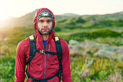 Buy stock photo Portrait of a focused young man out for a run on a cool morning