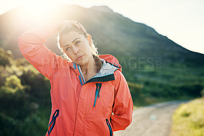 Buy stock photo Shot of an athletic young woman out for a run on a cool morning