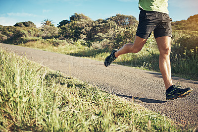 Buy stock photo Cropped shot of woman's legs while out for a run on a cool morning
