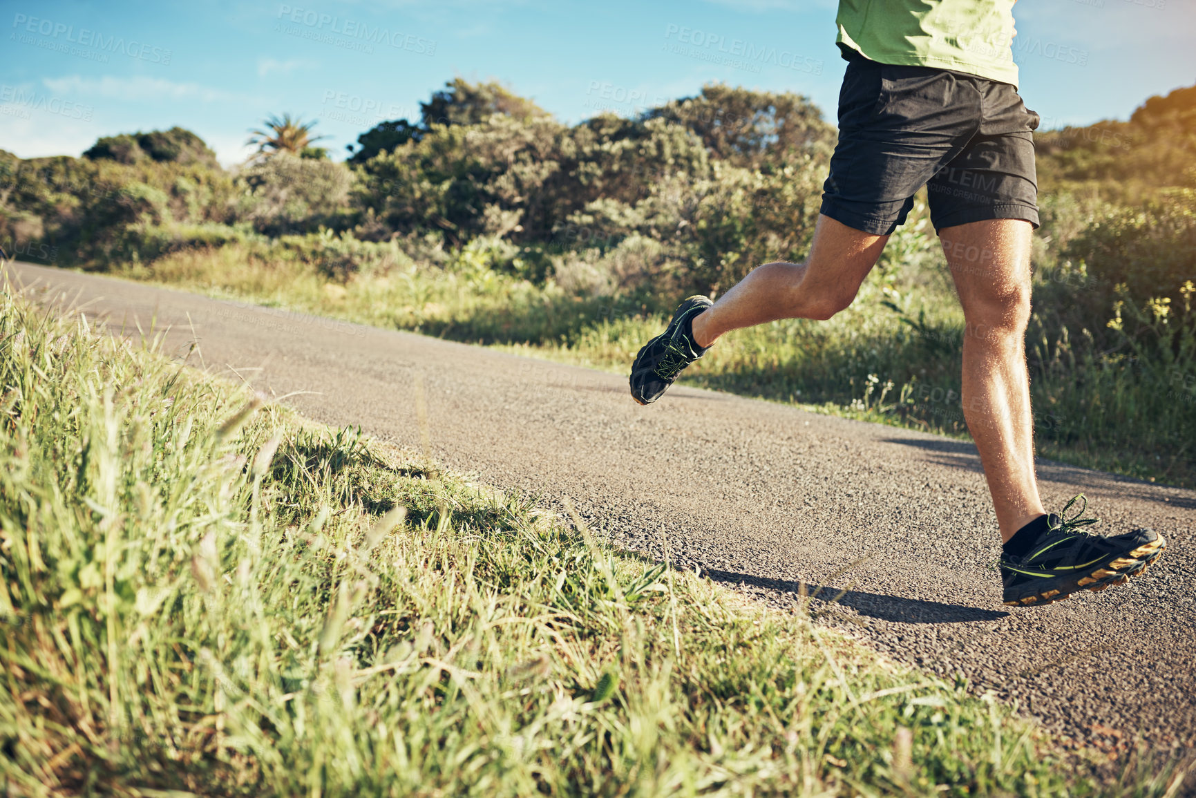 Buy stock photo Cropped shot of woman's legs while out for a run on a cool morning