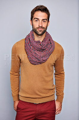 Buy stock photo Studio portrait of a handsome young man posing against a gray background