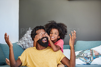 Buy stock photo Shot of a cheerful little boy holding his father's eyes closed from behind as a surprise at home