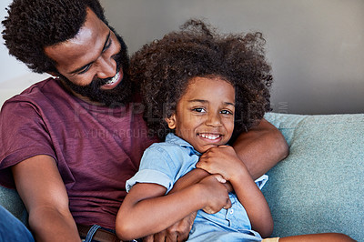 Buy stock photo Portrait of a cheerful father and son lying down and relaxing on the couch at home during the day