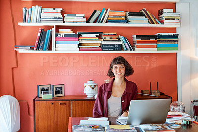 Buy stock photo Cropped portrait of a young woman sitting behind her laptop in the office