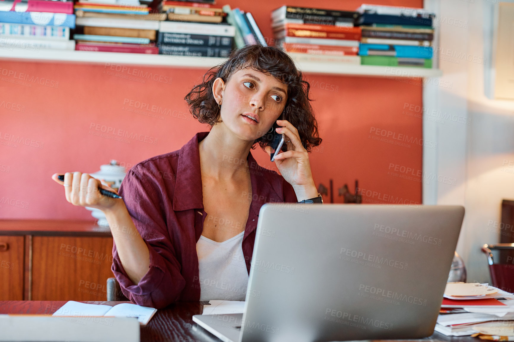 Buy stock photo Cropped shot of a creative worker talking on her cellphone in a modern office