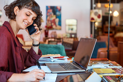 Buy stock photo Cropped shot of a creative worker talking on her cellphone in a modern office