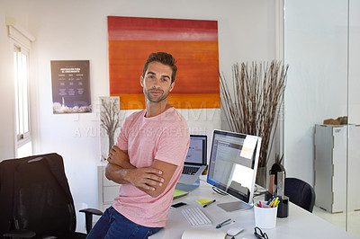 Buy stock photo Portrait of a handsome young businessman in his office