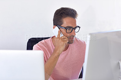Buy stock photo Shot of a businessman using his cellphone in his office