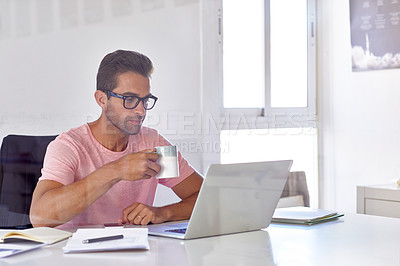 Buy stock photo Cropped shot of a handsome businessman working on his laptop in his office